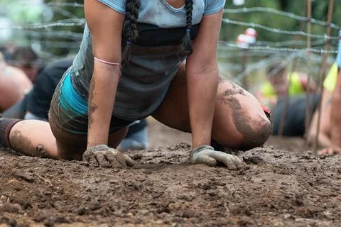 Mud race runners Stock Photos