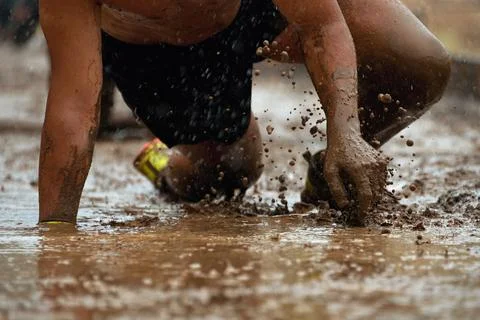 Mud race runners Stock Photos