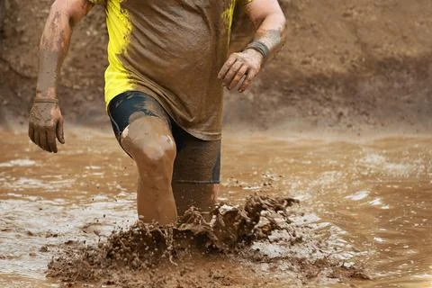 Mud race runners Stock Photos
