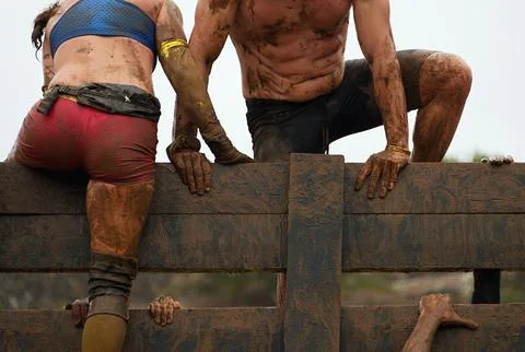 Mud race runners Stock Photos