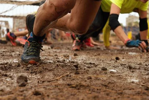 Mud race runners Stock Photos