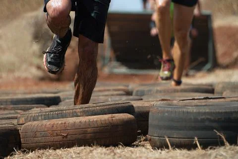 Mud race runners Stock Photos