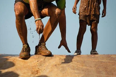Mud race runners Stock Photos