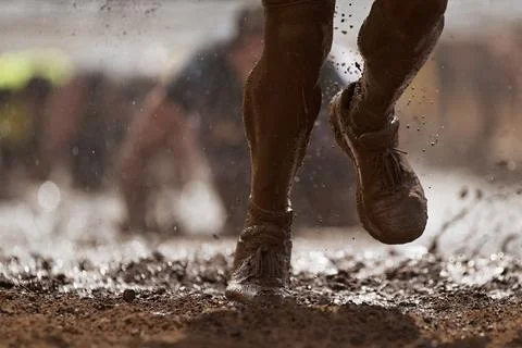 Mud race runners Stock Photos