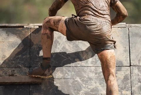 Mud race runners Stock Photos