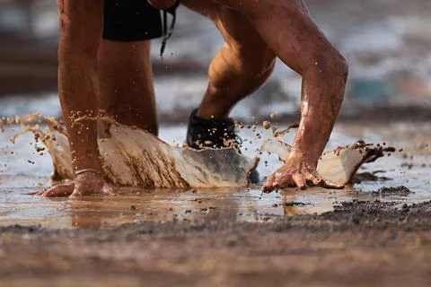 Mud race runners Stock Photos