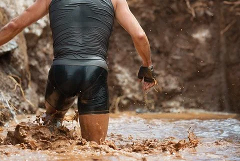 Mud race runners Stock Photos