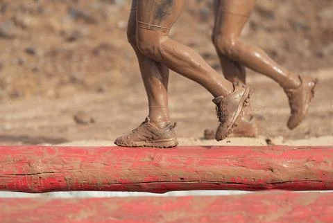 Mud race runners Stock Photos