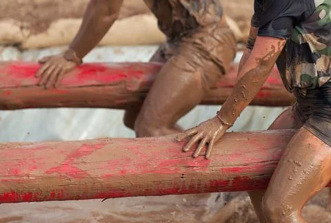 Mud race runners Stock Photos