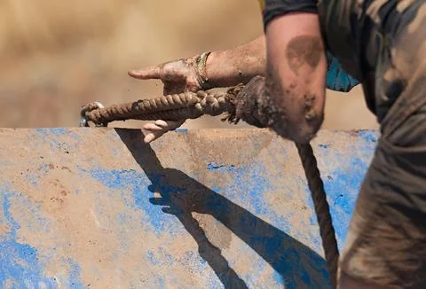 Mud race runners Stock Photos