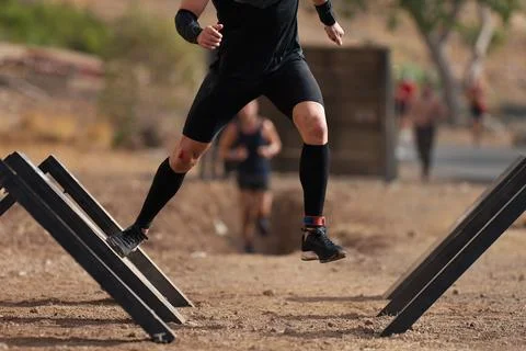 Mud race runners Stock Photos