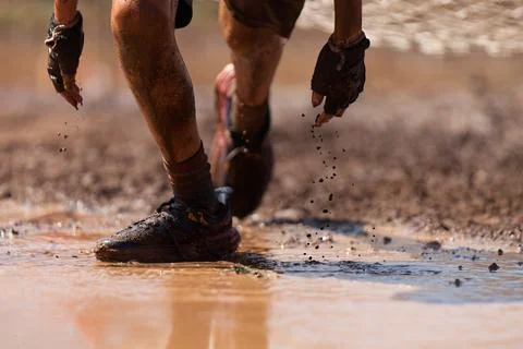Mud race runners Stock Photos