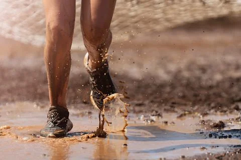Mud race runners Stock Photos