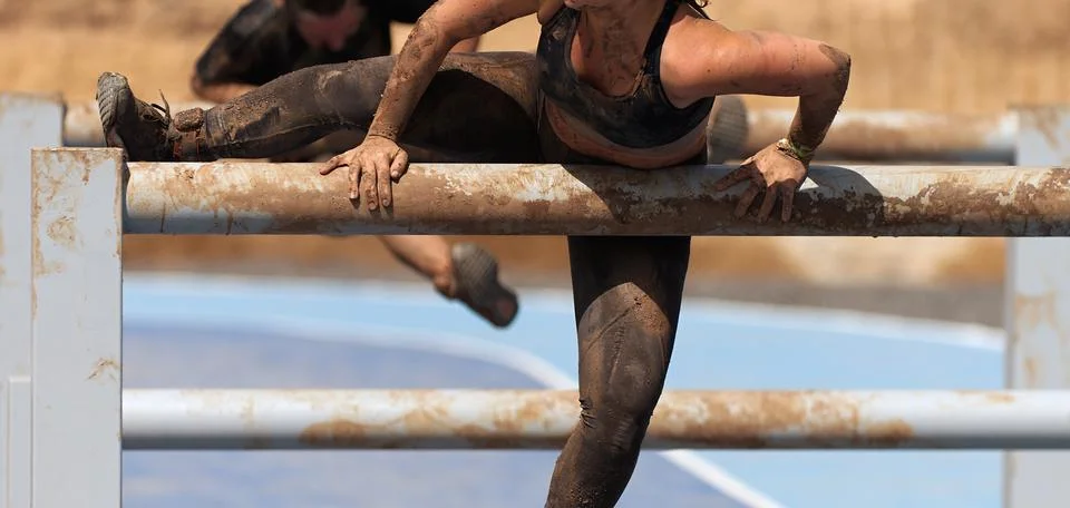 Mud race running Stock Photos