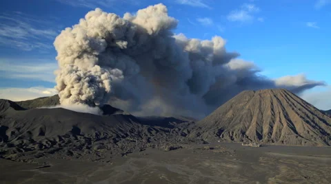 Mud river delta smoke and ash from Mt Bromo volcano Java Indonesia Stock Footage 67390970