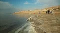 Mud therapy, people on the beach of Dead Sea, Jordan HD Footage
