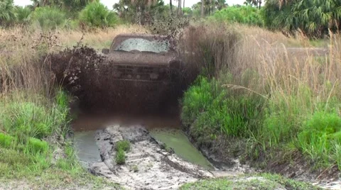 Mud truck driving through the mud  Stock Footage 64182365