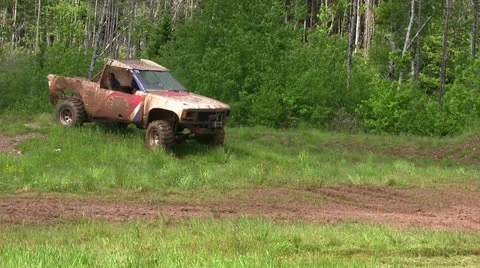 Mud Truck Jumps into Mud Stock Footage 25766248
