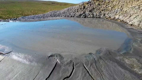 Mud volcano. Always active mud volcanoes surrounded by mountains Stock Footage 277669743