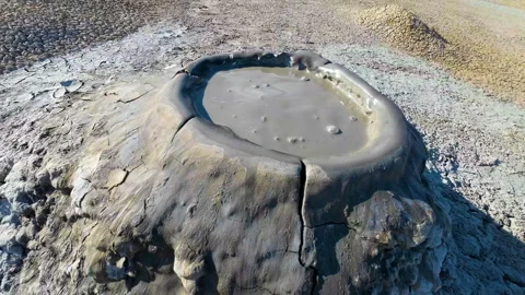 Mud volcano. Always active mud volcanoes surrounded by mountains Stock Footage 277669794