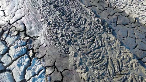 Mud volcano. Always active mud volcanoes surrounded by mountains Stock Footage 277669869