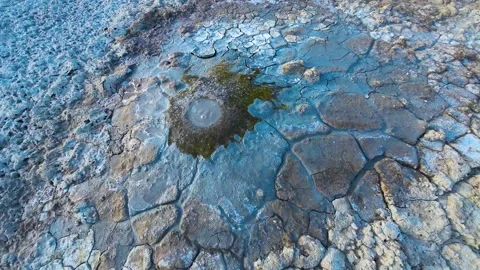Mud volcano. Always active mud volcanoes surrounded by mountains Stock Footage 277670202