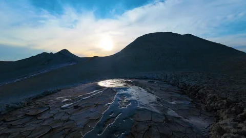 Mud volcano. Always active mud volcanoes surrounded by mountains Stock Footage 277670383
