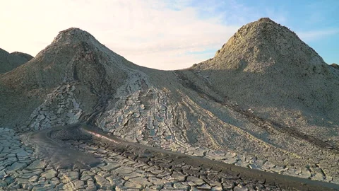 Mud volcano. Always active mud volcanoes surrounded by mountains Stock Footage 277670451