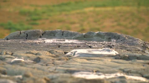Mud volcano. Always active mud volcanoes surrounded by mountains Stock Footage 277670480