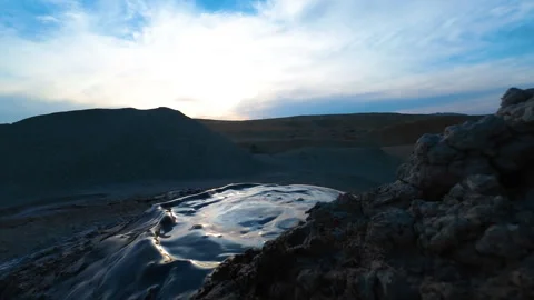 Mud volcano. Always active mud volcanoes surrounded by mountains Stock Footage 277670489