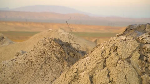 Mud volcano. Always active mud volcanoes surrounded by mountains Stock Footage 277670510