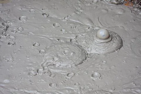 Mud volcano boiling Stock Photos