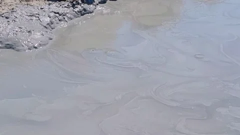 Mud volcano Hephaestus. Close up bubbles in mud volcano Pool with ladder to go d Stock Footage 301466860