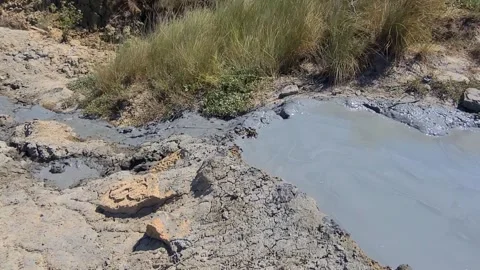 Mud volcano Hephaestus flows from one crater to another. The Pool with volcanic  Stock Footage 301452127