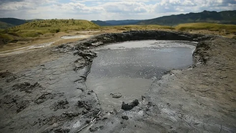 Mud volcanoes also known as mud domes boiling in summer season 스톡 동영상 71616361