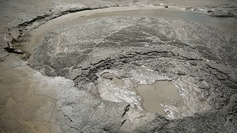 Mud volcanoes also known as mud domes boiling in summer season Vídeo Stock 71616875