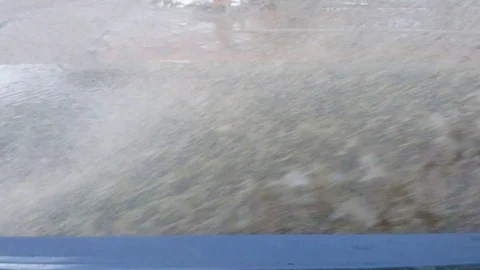 Mud water flies on the sidewalk from a speeding car, inside view Stock Footage 120936295