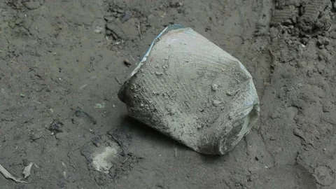 Muddy and dry plastic cup trash Video stock 197645295