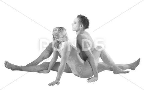 Muddy couple sitting into each other Stock Photos