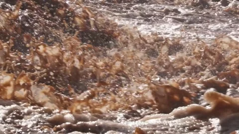 Muddy flooded river splash after torrential rain storm Video stock 277936869