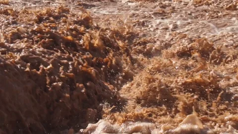 Muddy flooded river splash on rapid Stock Footage 121933097