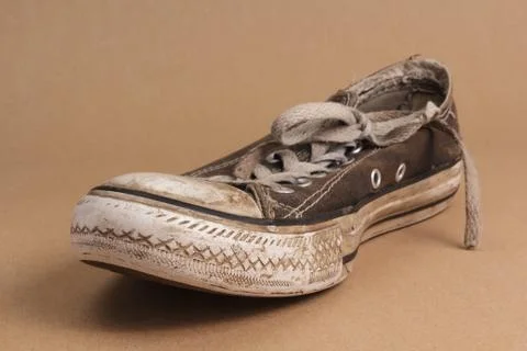 Muddy old trainer Stock Photos