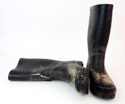 Muddy pair of boots Stock Photos