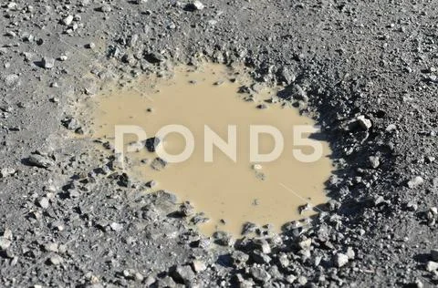 Muddy puddle Stock Photos