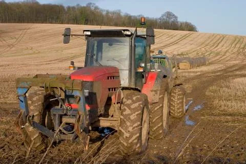 Muddy Red Tractor Stock Photos