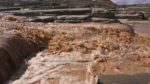 Muddy river flooded after heavy rain storm slow motion Stock Footage 121933009