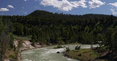 Muddy river flowing through a canyon 4k 24fps rev 2 Stock Footage 77307195