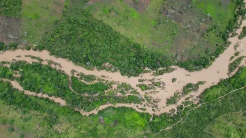 Muddy river running through rural villages in Tanzania, Africa Stock Footage 235444110