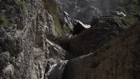 Muddy Stream Flowing Between Rocky Cliffs Video stock 318844470