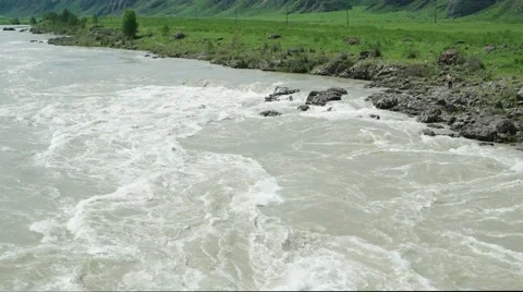 Muddy stream of Mountain river with rocky bank. Katun, Altai, Siberia Stock Footage 67711756
